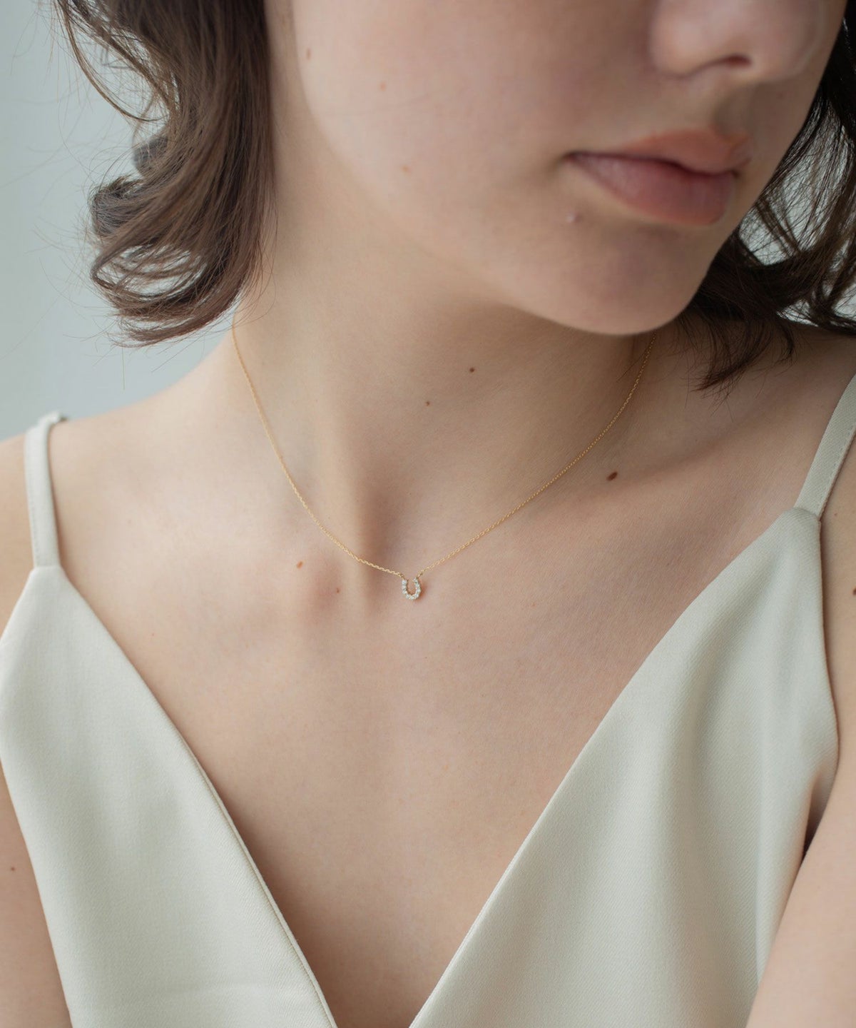 【web限定】[K10]タイニーホースシューパヴェダイヤモンドプチペンダント