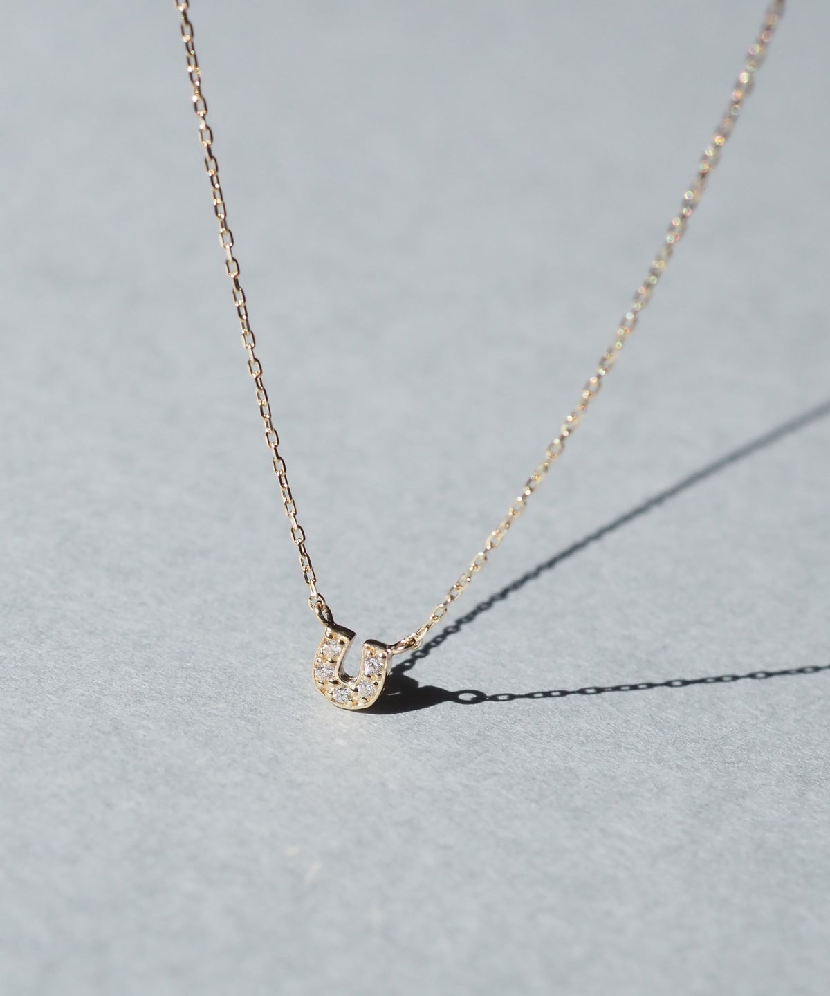 【web限定】[K10]アーバンパヴェホースシューダイヤモンドプチペンダント